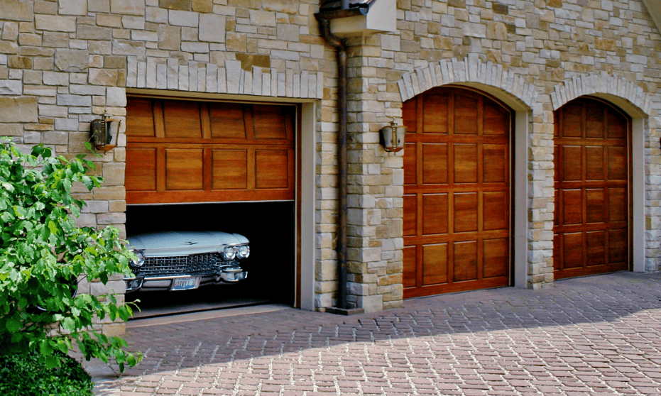 garage door opening with vintage car
